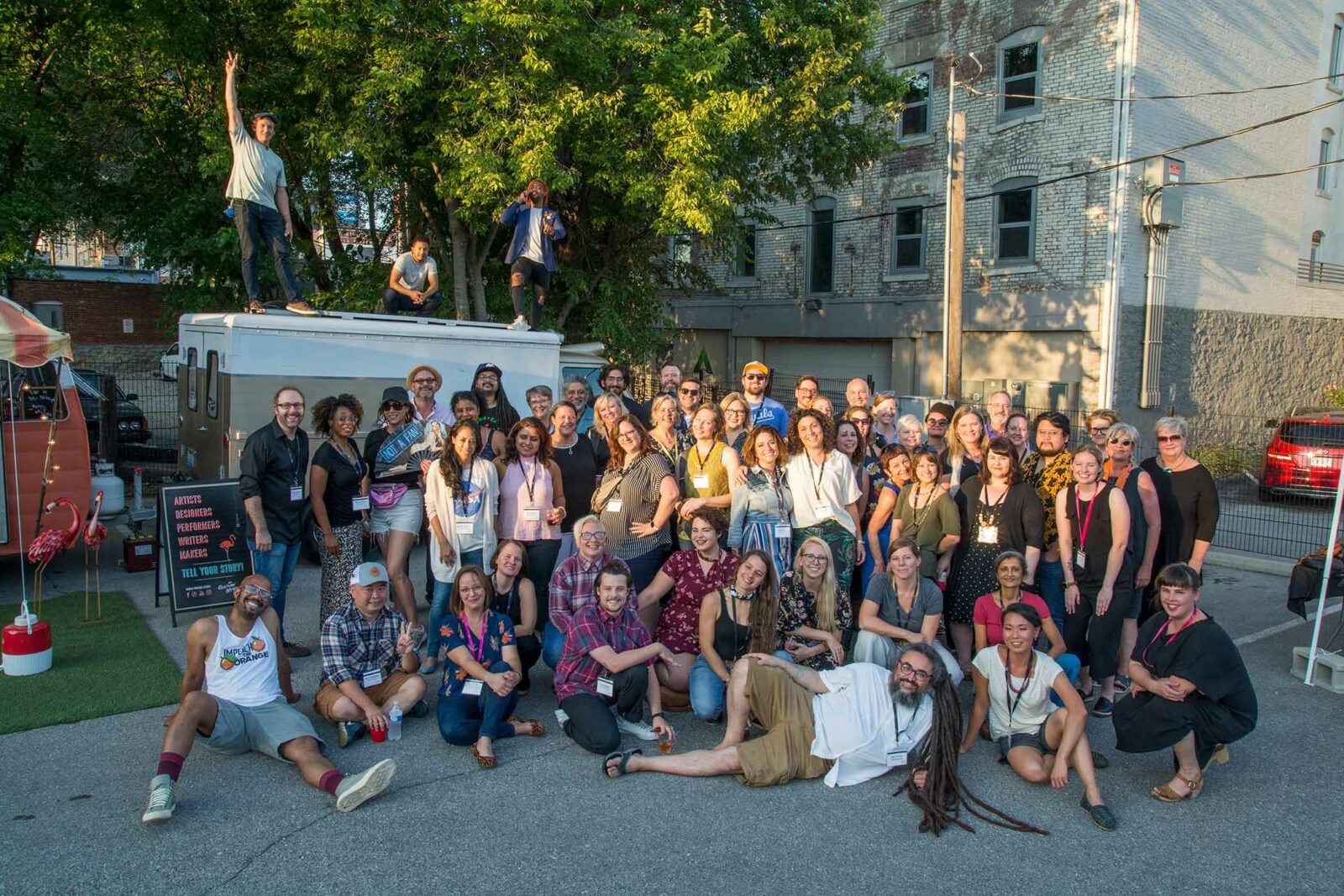 A large gathering of Artist INC artists pose for a group photo