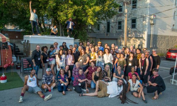 A large gathering of Artist INC artists pose for a group photo