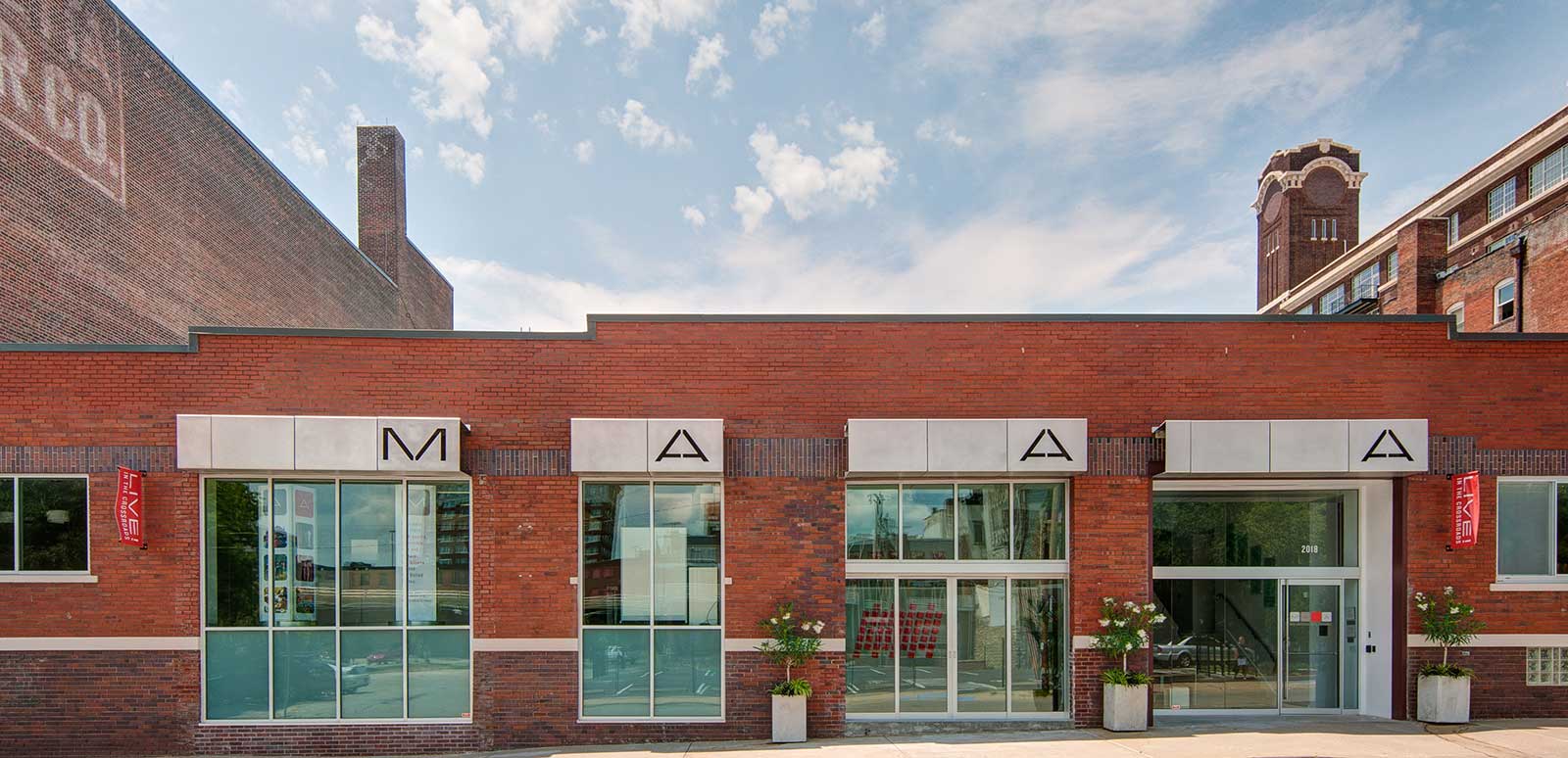 exterior of brick building with large windows