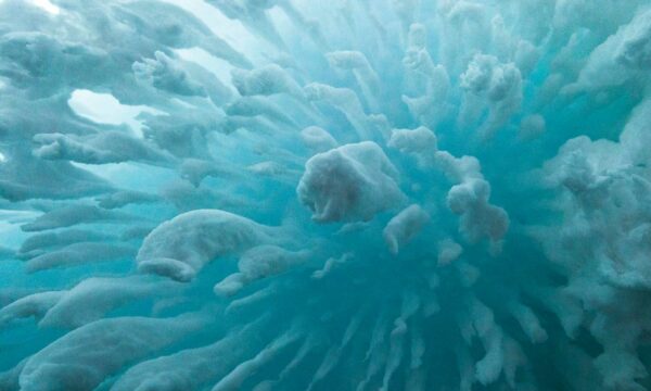 ice formations in teal/blue water