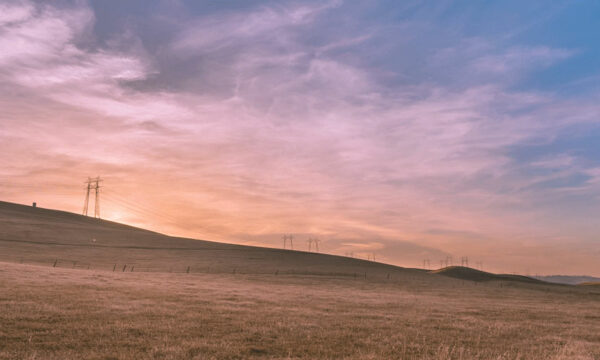 Horizon image with pink sunrise and blue sky.