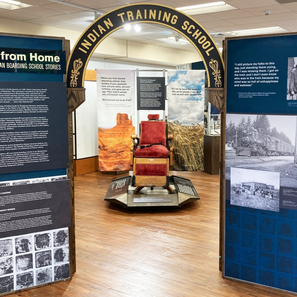 Barber chair with a single braid laid on the seat in center from the Away from Home exhibition